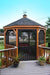 Amish Wood Gazebo-In-A-Box with weathervane on top and flowers