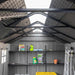 Interior view of the Lifetime dual entry storage shed showing the ridge skylight, shelving, and a ladder stored inside.