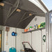 Interior view of the Lifetime 10x8 ft. storage shed showing the roof truss, wall shelf, and stored tools.