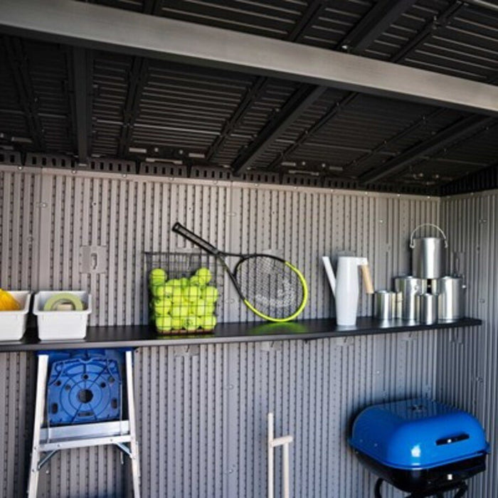 Close-up of the Lifetime Modern Shed's interior shelf with tennis balls, a racket, and a watering can.