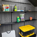 Close-up of the Lifetime storage shed's interior shelving holding gardening supplies and storage bins.