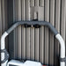 Close-up of a mower handle mounted on the Lifetime Modern Shed's interior wall hook.