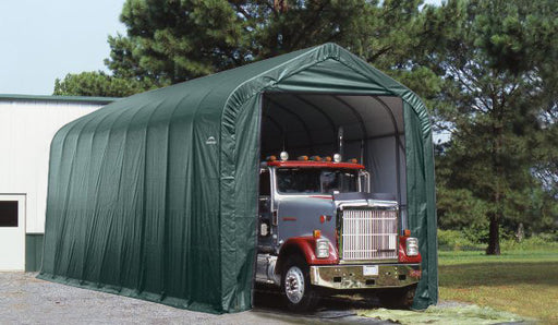 ShelterLogic ShelterCoat 16 x 36 ft. garage with truck parked inside. This green, peak-style garage provides ample storage for vehicles and other equipment.