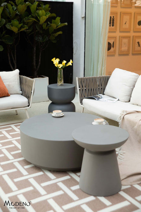 Outdoor setting featuring the Elementi Kylix Series large side table in space grey alongside other furniture.