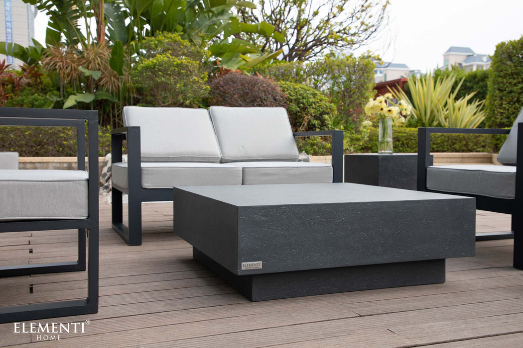 sleek modern balcony setup with the Elementi Tevere Series Square Coffee Table in Slate Black, paired with contemporary grey outdoor seating.