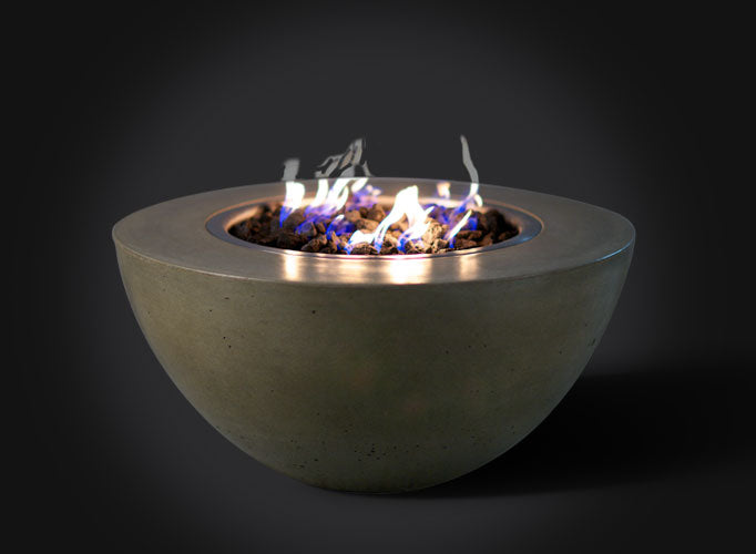 Slick Rock's Oasis Fire Bowl in gray concrete with a burning flame.