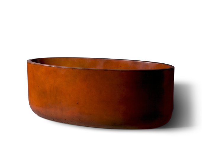 Slick Rock Bell Linear 60 in. concrete planter trough in rust orange stain, side view