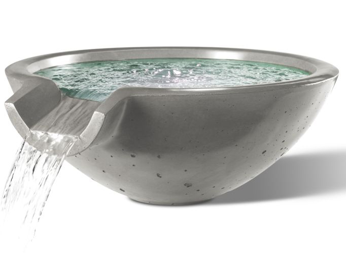 A Camber Water Bowl fountain with a gray concrete finish. Water flows from a rectangular spout and spills into the bowl-shaped basin.