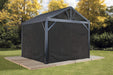 Sojag 12x12 Black Curtain hung on a Sojag Gazebo with trees in the back