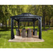 Front view of the Sojag Mykonos II 12x16 gazebo with an outdoor dining set under it in a backyard setting