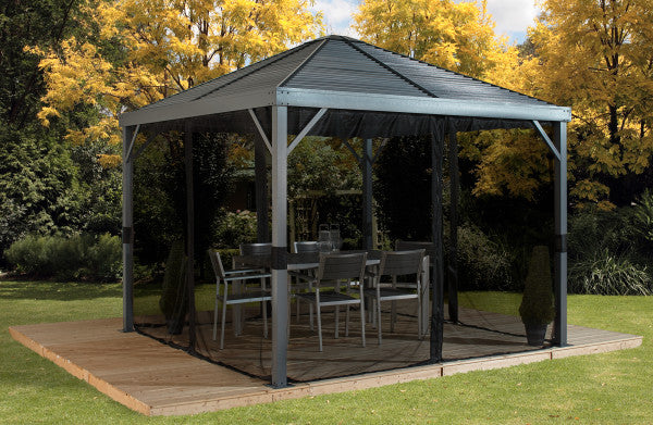 Sojag Sanibel 8 x 8 ft. Gazebo with closed Mosquito Netting and patio furniture inside in a backyard setting