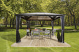 Sojag Verona 10x12 ft Gazebo showcasing patio furniture arrangement on lush green lawn.