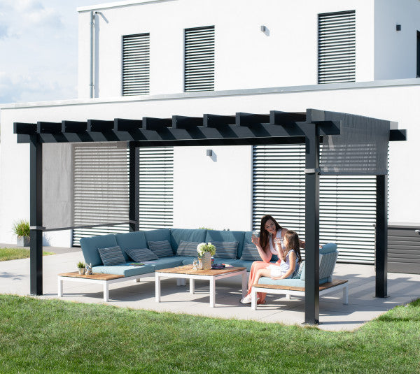 Contemporary outdoor seating under the Sojag Yamba Pergola 10x16 ft, with people enjoying a conversation in a stylish backyard