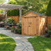 SpaceMaster 6x4 cedar shed showing double door detail with wood paneling and sturdy hinge hardware.