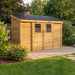 Side angle view of the SpaceSaver 12x4 lean-to shed with wooden sliding doors and slanted roof design.