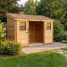 Side angle view of the Outdoor Living Today SpaceSaver 12x4 shed showing its sliding doors and wood siding.
