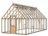 A large, Alton Cedar Lancing 10x20 wooden greenhouse with a pitched roof and ornate cresting.