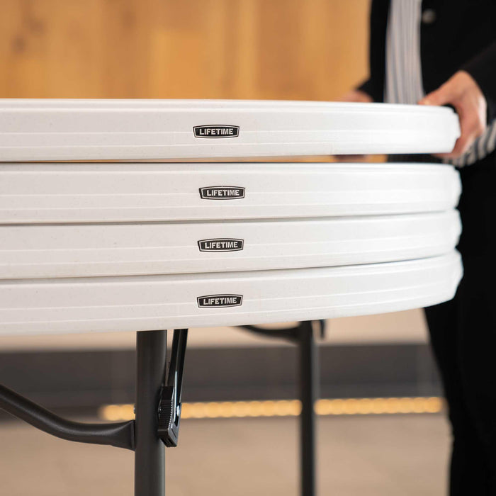 Close up of stacked Lifetime 4 Pack 60 Inch Round Nesting Table edges with nesting profile for space saving storage