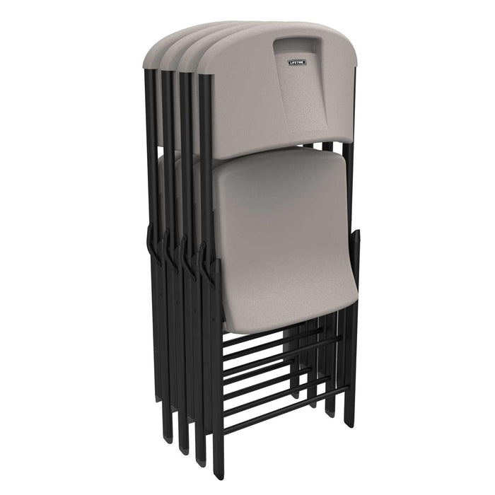 Stacked Lifetime 4-Pack Classic Folding Chairs in putty with black frame for compact storage