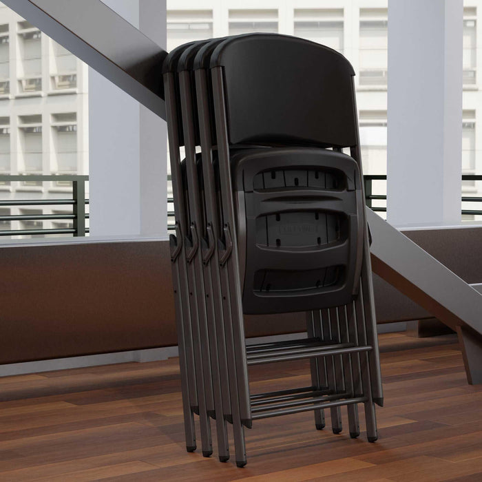 Lifetime 4-Pack Classic Folding Chairs in black stacked indoors highlighting thin profile for compact storage