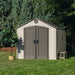 Lifetime 8x12.5 ft. storage shed in a backyard with a potted plant, front angle view with closed doors.