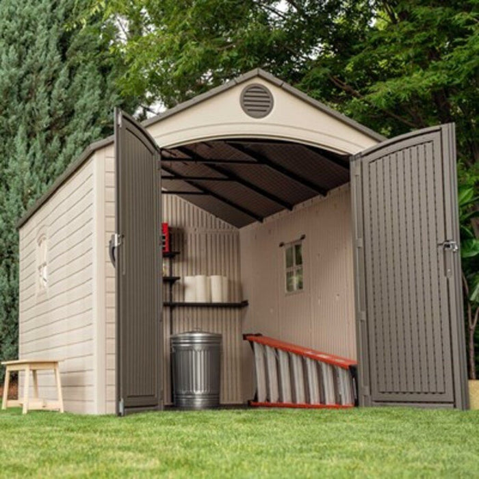 Interior view of the Lifetime 8x12.5 ft. storage shed with open doors showing shelving, trash can, and ladder.
