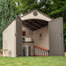 Interior view of the Lifetime 8x12.5 ft. storage shed with open doors showing shelving, trash can, and ladder.
