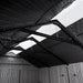 Interior view of the Lifetime storage shed looking up at the roof trusses and five skylight panels.