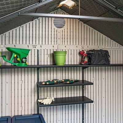 Interior view of the Lifetime 8x15 ft. storage shed showing the roof truss and shelving with tools.