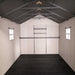 Interior view of the Lifetime 8x12.5 ft. storage shed showing the roof truss, side windows, and shelving rail.