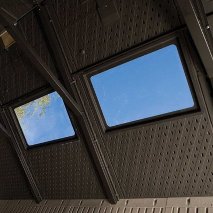 Interior view of the Lifetime 15x8 ft. storage shed looking up at the roof truss and skylight panels.