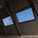 Interior view of the Lifetime 15x8 ft. storage shed looking up at the roof truss and skylight panels.
