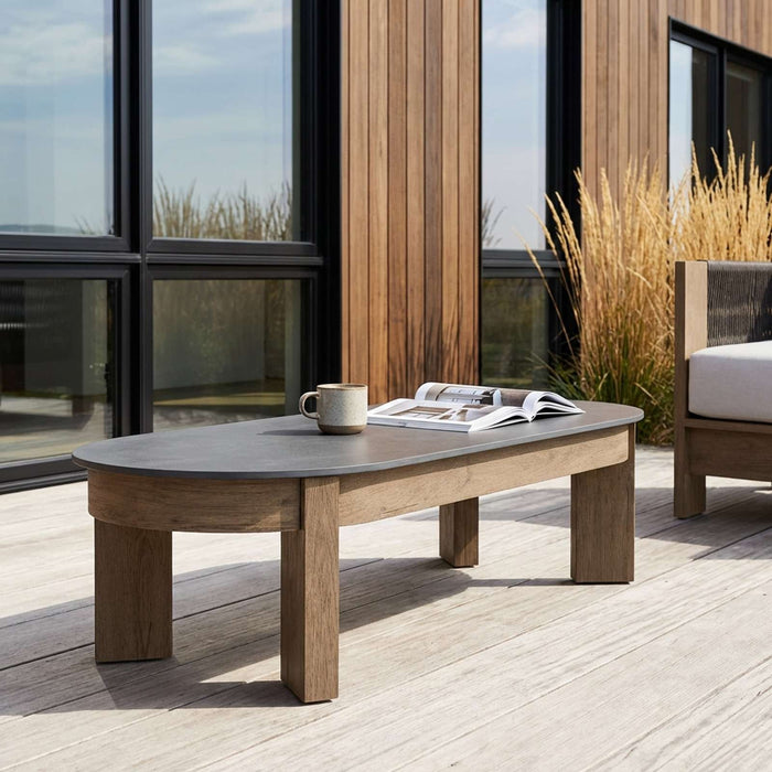 Stratton 55 coffee table outdoor patio lifestyle with Stratton lounge chairs