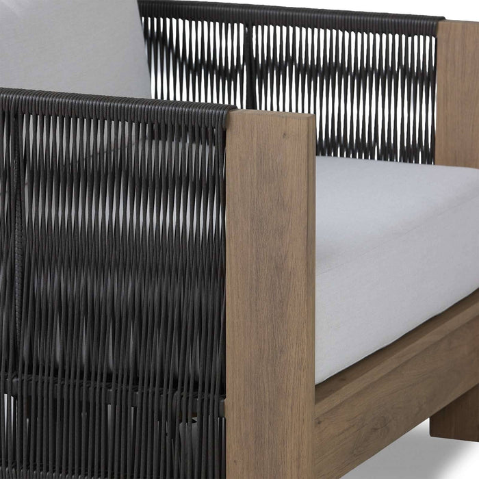 Stratton lounge chair woven cord webbing and wood-look frame detail close up