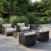 Stratton outdoor lounge chair lifestyle setting with coordinating patio furniture