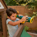 A kid playing the telescope inside the portland playhouse