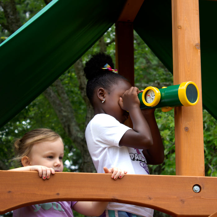 A girl using the telescope feature of the Gorilla Playsets