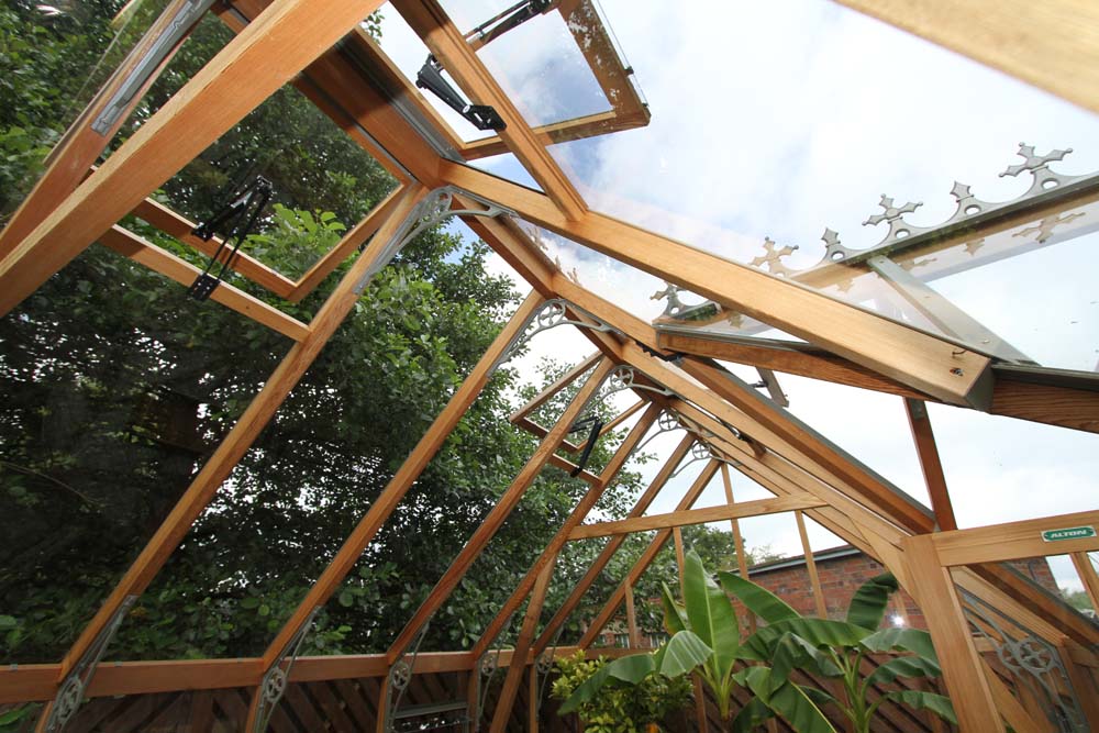 Ventilation features in the roof of the Alton Cambridge Cedar Greenhouse with operable glass windows.