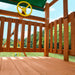 An angle view from the play deck of the Cedar Slide Swing Set featuring the lumber and the yellow steering wheel