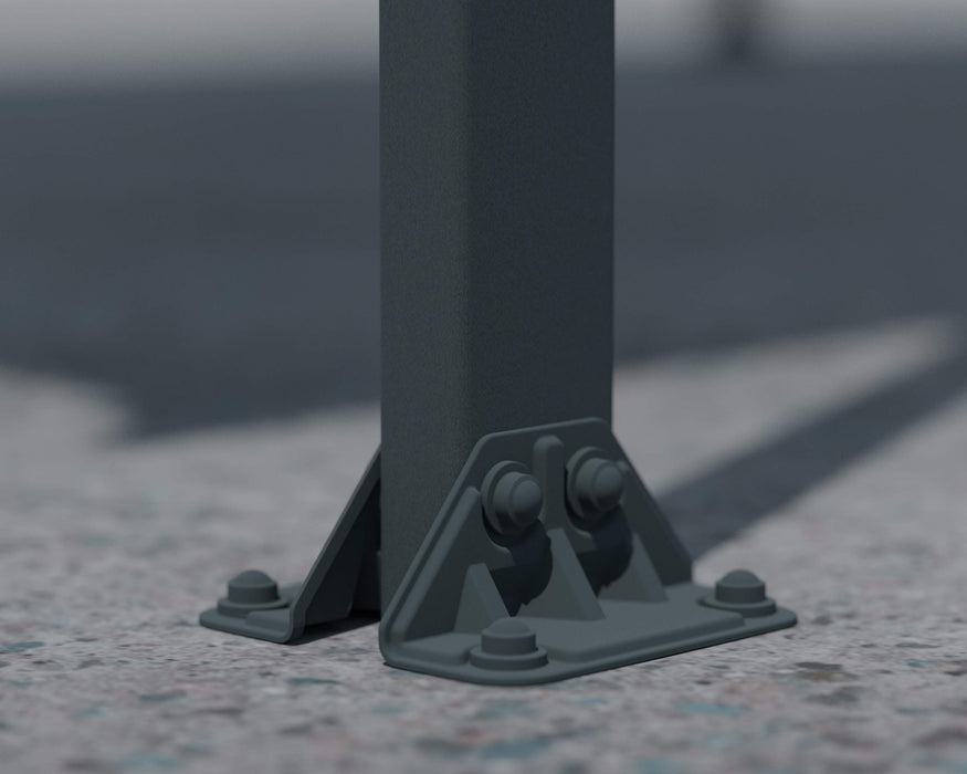 Close-up of the base anchoring system of the canopia Vitoria 5000 10x16 Carport, showing bolts securing the structure to the ground.