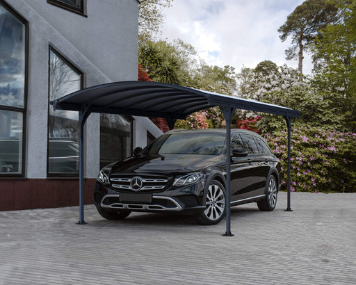 A sleek black car parked under a curved canopy of the Canopia Vitoria 5000 10x16 Carport in a modern driveway setting.