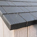 Close-up of the Lifetime storage shed's weather-resistant roof shingle detail with water droplets.