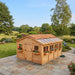 Western red cedar Sunshed 12x16 garden shed showing detailed wood paneling, double doors, and window trim.