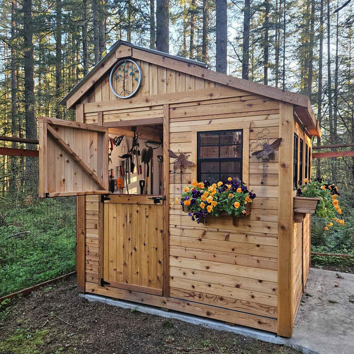 Western red cedar Sunshed 8x8 garden shed shown from a side angle, highlighting its wood siding and windowed doors.