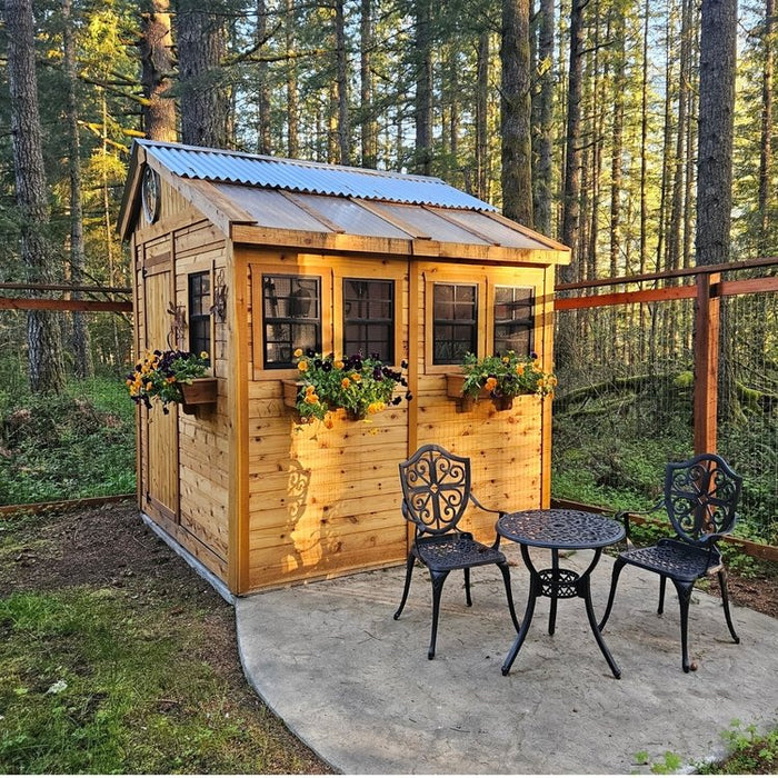 Front view of the Western Red Cedar Sunshed Garden Shed 8x8, showcasing its wood construction and dual doors.