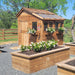 Western red cedar Sunshed garden shed, 8x8 size, shown from a side angle highlighting its wood grain and roof design.