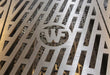 Detailed view of the custom WF logo cooking grates on the Wildfire Grill.