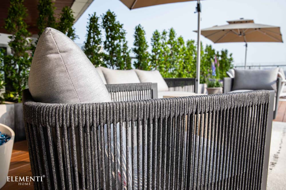 Close-up rear angle showcasing the detailed woven rope backrest of the Capri Collection outdoor chair by Elementi, emphasizing quality craftsmanship.