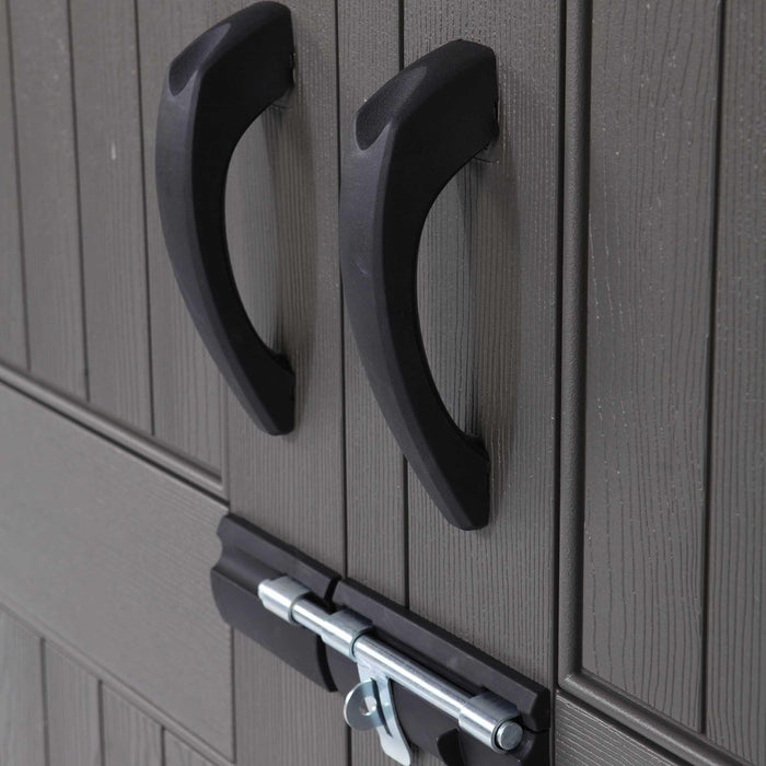 Two handles attached to a door of a Shed 