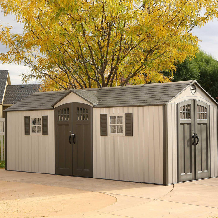 An angled view of a house-like Outdoor Storage Shed